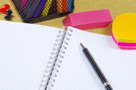 Notebook  and pen on wooden table