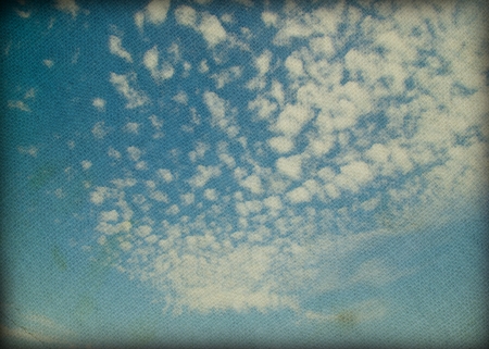 grunge image of blue sky with cloudsの写真素材