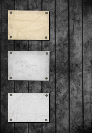 Note paper and paper clip on wooden backgroundの写真素材