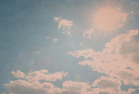 grunge image of blue sky with cloudsの写真素材