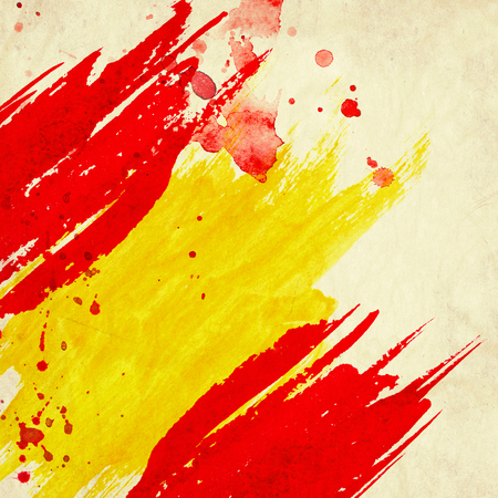 Grunge background in colors of spanish flagの写真素材