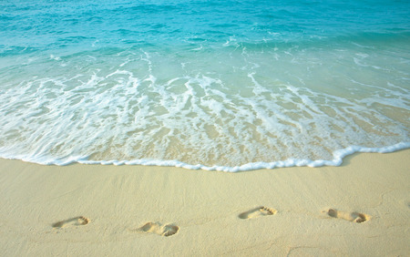 Human footprints on a sandy beach.の写真素材