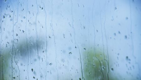 Rain drops on window glasses surface.の写真素材