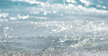 Soft wave of sea on sandy beach. background.