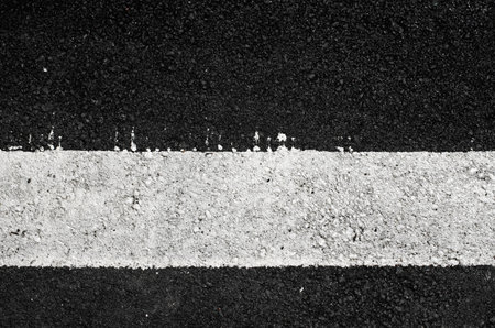 asphalt texture with a white line paintedの写真素材