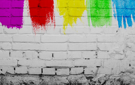 color paint on a white brick wallの写真素材