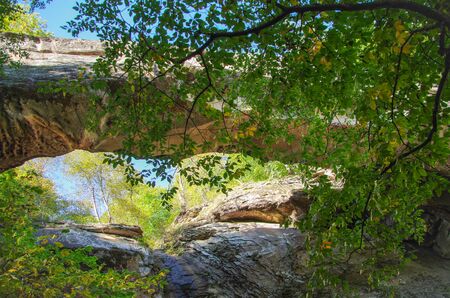 Natural bridge. Arch bridge over the gorge. Ancient sacred place for inhabitants of the region. Height 1400 m above sea level. North Caucasus. Russia, Dagestan, Tabasaransky District, near Kuzhnikの写真素材