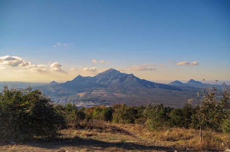 Scenic autumn view of Beshtau on a background of sunset sky. Beshtau is an isolated five-domed igneous mountain near Pyatigorsk in the Northern Caucasus. View from Mount Mashuk. Russia, Stavropol Kraiの写真素材