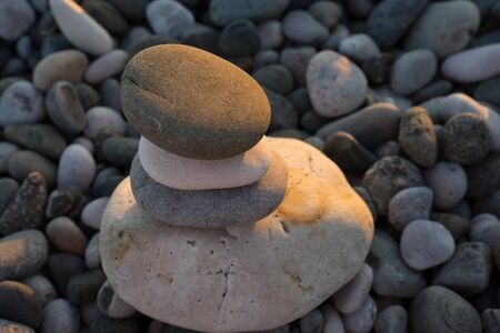 multi-colored sea pebbles of different sizes and shapesの写真素材
