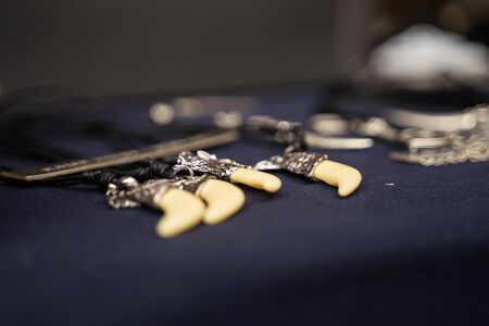 metal products on the neck with a pendant and without it lie on a blue backgroundの写真素材