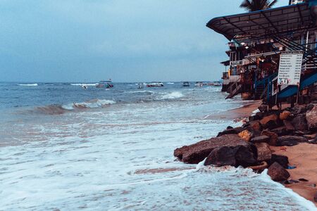 waves of the indian ocean with boats