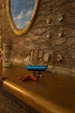wooden boat stands on the tableの写真素材