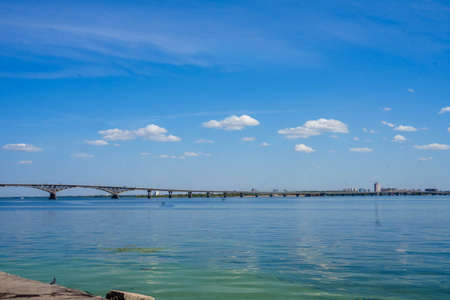 embankment overlooking the bridge and against the blue skyの写真素材