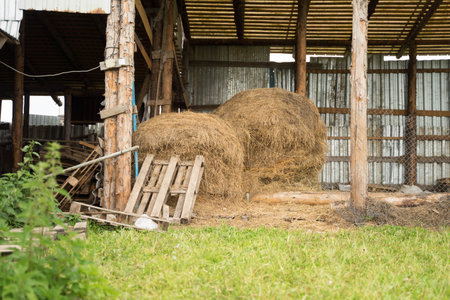 large wooden shed with hay