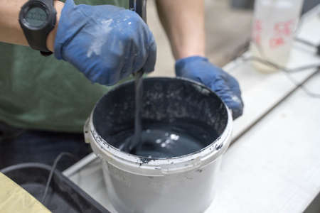 white plastic jar with dark paintの写真素材