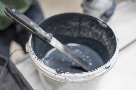 white plastic jar with dark paintの写真素材