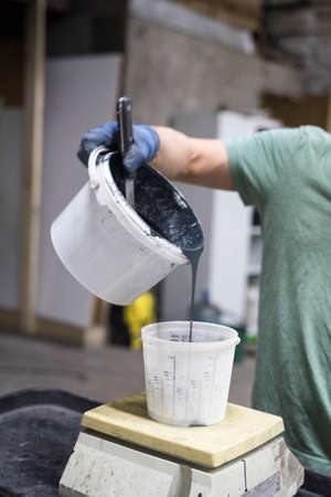 white plastic jar with dark paintの写真素材