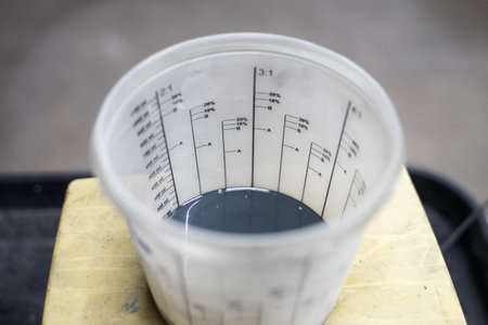 white plastic jar with dark paintの写真素材