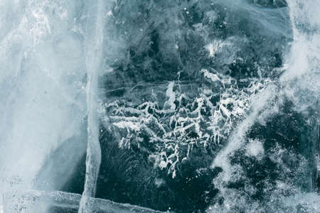 transparent ice floes lie on the transparent ice of the lake