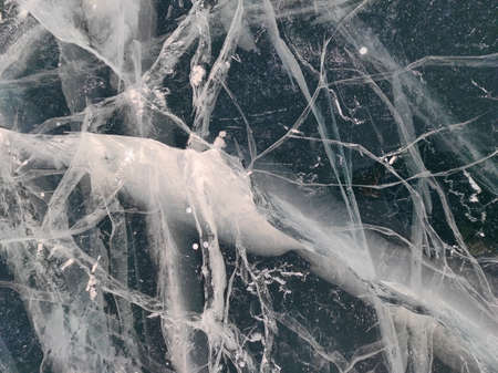 transparent ice with bubbles and cracks