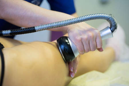 woman doing massage with massage device