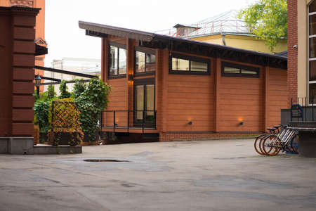 dark orange wooden house with ivy