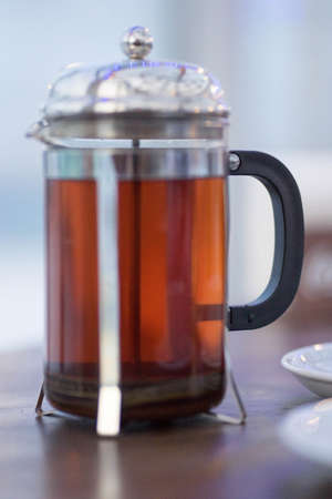 glass teapot with lid with brewed teaの写真素材
