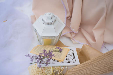 composition with a lantern and flowers in the snowの写真素材