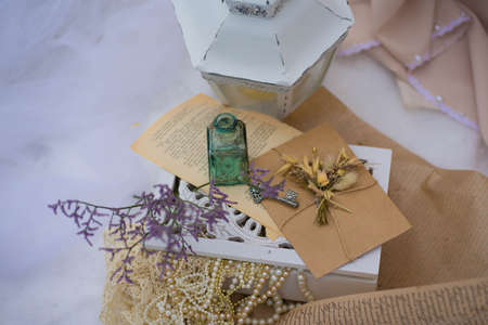 composition with a lantern and flowers in the snowの写真素材