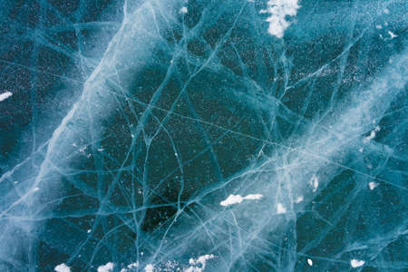 cracks in the transparent ice of Lake Baikal in winter