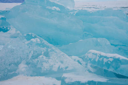 blue transparent ice lies in blocksの写真素材