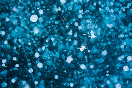 blue transparent ice with white bubbles
