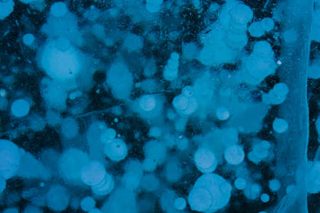 blue transparent ice with white bubbles