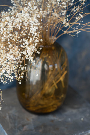 large glass vase with white flowersの写真素材