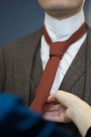girl wearing a tie to a man
