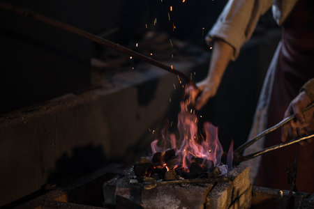 bright fire with sparks burns in the forgeの写真素材