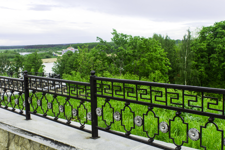 View from the park with a beautiful decorative fenceの写真素材