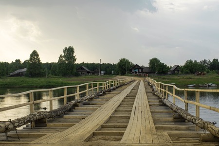 Temporary wooden bridge across the riverの写真素材