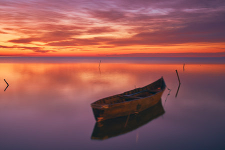 sunrise with boats on the lake in the Danube Delta 4