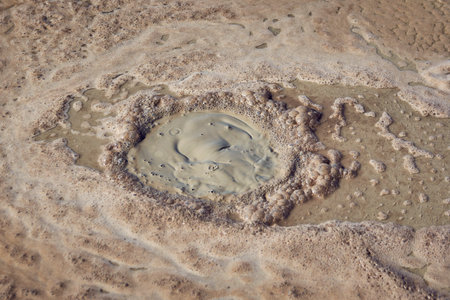 cones of mud volcanoes from which rivers of mud flowの写真素材