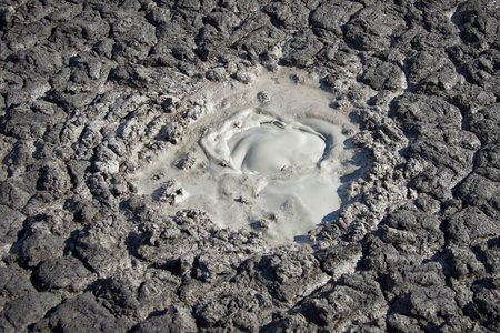 cones of mud volcanoes from which rivers of mud flow