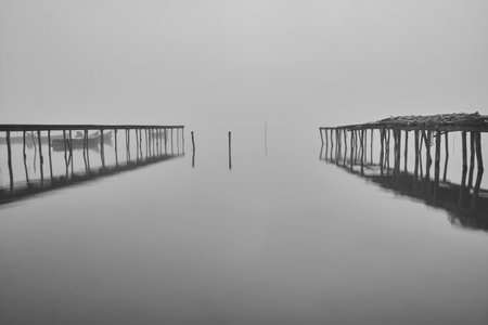 fishing boats at sunrise on the lakeの写真素材
