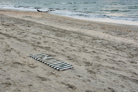 abandoned waste on the sea beachの写真素材