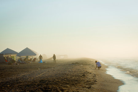 sunrise with fog at seaの写真素材