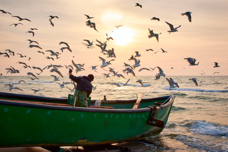 sunrise with a fishing boat on the Black Seaの写真素材