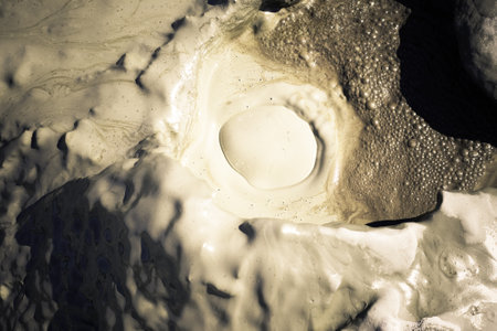 cones of mud volcanoes from which rivers of mud flowの写真素材
