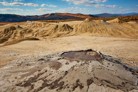 cones of mud volcanoes from which rivers of mud flowの写真素材