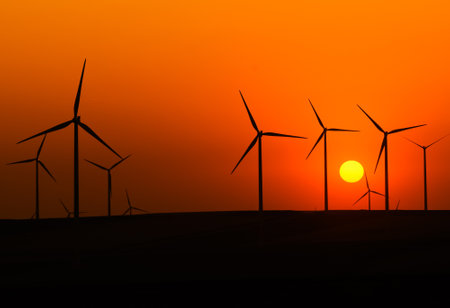 wind turbines in the sunsetの写真素材