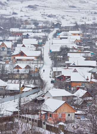 winter landscape with country houses covered with snowの写真素材