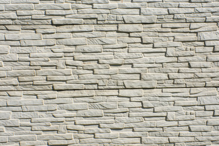 Stone wall with stone shapes isolated on background
